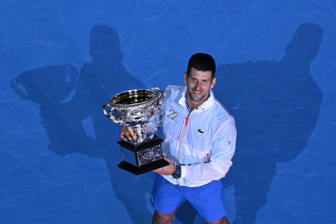 Novak Djokovic of Serbia holds the Norman Brooks Challenge Cup following his win in the Mens Singles Final against Stefanos Tsitsipas of Greece at the 2023 Australian Open tennis tournament at Melbourne Park in Melbourne, Sunday, January 29, 2023. (AAP