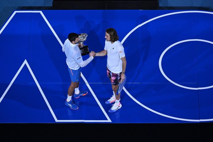 Novak Djokovic of Serbia shakes hands with Stefanos Tsitsipas of Greece following the Mens Singles Final at the 2023 Australian Open tennis tournament at Melbourne Park in Melbourne, Sunday, January 29, 2023. (AAP Image/Lukas Coch) NO ARCHIVING, EDITOR