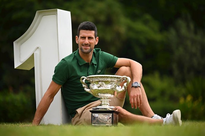 Novak Djokovic of Serbia poses for a photograph with the Norman Brooks Challenge Cup following his win in the mens singles final in the 2023 Australian Open tennis tournament, at Government House in Melbourne, Monday, January 30, 2023. (AAP Image/James