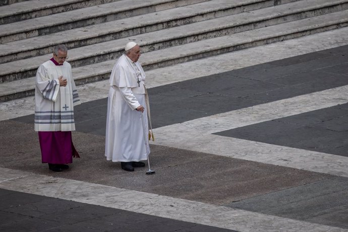 05 January 2023, Vatican, Vatican City: Pope Francis (R) walks with walker during the public funeral Mass for Pope Emeritus Benedict XVI in St. Peter's Square. Photo: Oliver Weiken/dpa