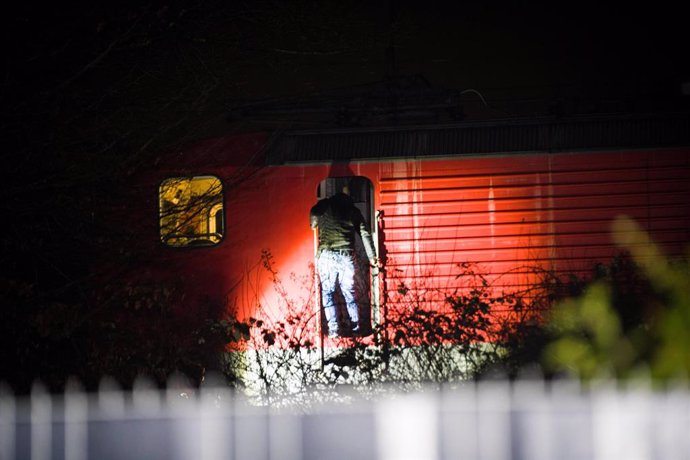 02 February 2023, North Rhine-Westphalia, Recklinghausen: A man stands at a train car at the site where two children were hit by a freight train in Recklinghausen. Photo: Marc Gruber/7aktuell.de/Marc Gruber/dpa