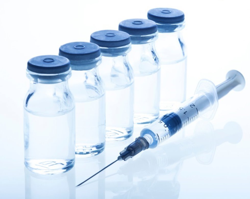 Archivo - Glass Medicine Vials and Syringe