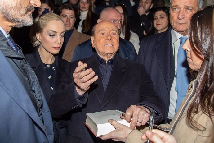 12 February 2023, Italy, Milan: Silvio Berlusconi, former Prime Minister of Italy and leader of the Forza Italia party, signs an autograph while voting for the 2023 regional elections in Lombardy. Photo: -/LaPresse via ZUMA Press/dpa