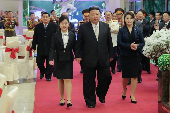 HANDOUT - 08 February 2023, North Korea, ---: Apicture provided by North Korea's state news agency KCNA on 08 February 2023, shows North Korean leader Kim Jong Un, walking with his wife Ri Sol Ju and daughter during a banquet at an undisclosed location