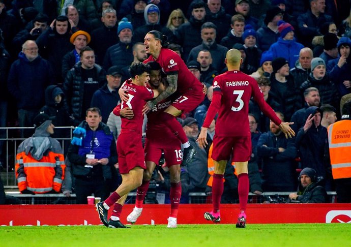 13 February 2023, United Kingdom, Liverpool: Liverpool's Cody Gakpo celebrates with his team-mates after scoring their side's second goal of the game during the English Premier League soccer match between Liverpool and Everton at the Anfield. Photo: Pet