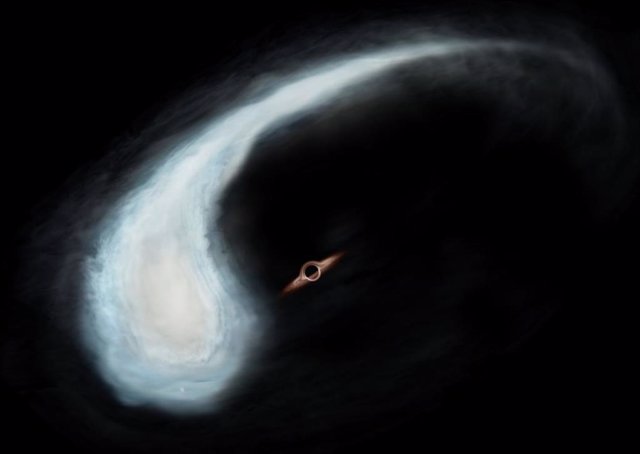 Impresión artística de la nube molecular "Renacuajo" y el agujero negro en el centro gravitatorio de su órbita.