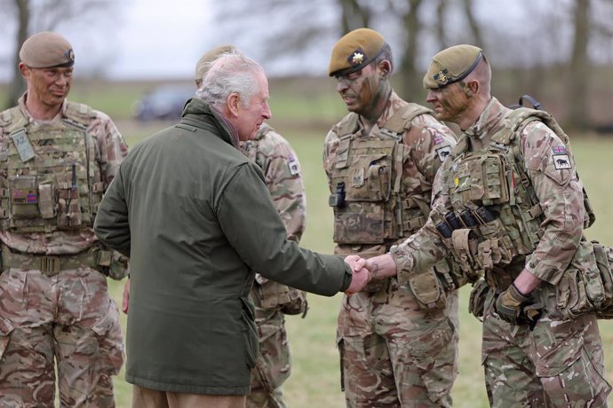 20 February 2023, United Kingdom, Wiltshire: King Charles III meets Ukrainian recruits during a visit to a training site for Ukrainian military, where recruits are completing five weeks of basic combat training by British and international partner force