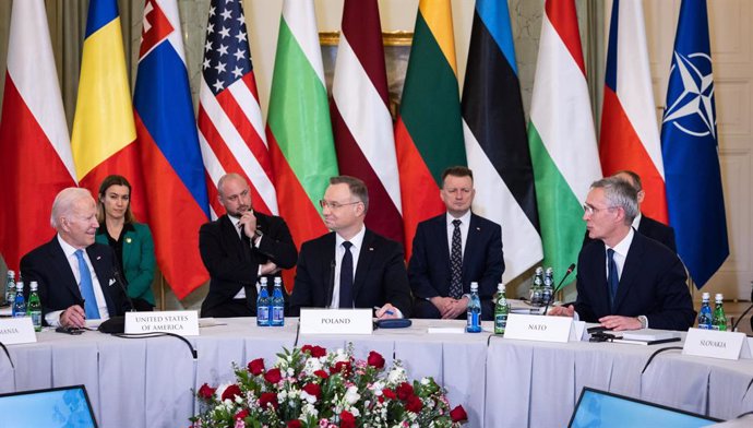 HANDOUT - 22 February 2023, Poland, Warsaw: NATO Secretary General Jens Stoltenberg (R), US President Joe Biden (L)and President of Poland Andrzej Duda (C) attend the B-9 Summit. Photo: -/NATO/dpa - ATTENTION: editorial use only and only if the credit 