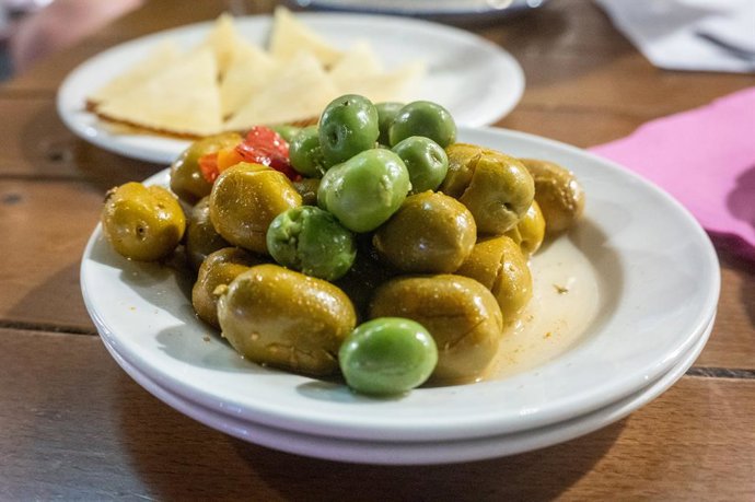 September 19, 2022, Seville, Spain: Tapas plate of various olives, Seville, Spain