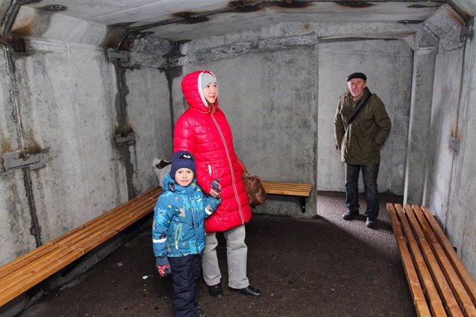 February 28, 2023, Dnipro, Ukraine: A senior man and a woman with a boy stay in a concrete bomb shelter on Oleksandra Polia Avenue, Dnipro, central Ukraine.,Image: 759281103, License: Rights-managed, Restrictions: , Model Release: no, Credit line: Mykol