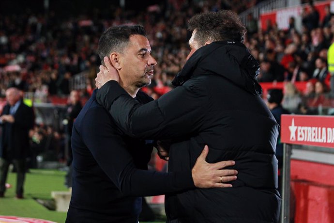 Miguel Angel Sanchez "Michel", head coach of Girona FC and Diego Pablo Simeone, head coach of Atletico de Madrid greet each other during the spanish league, La Liga Santander, football match played between Girona FC and Atletico de Madrid at Montilivi s