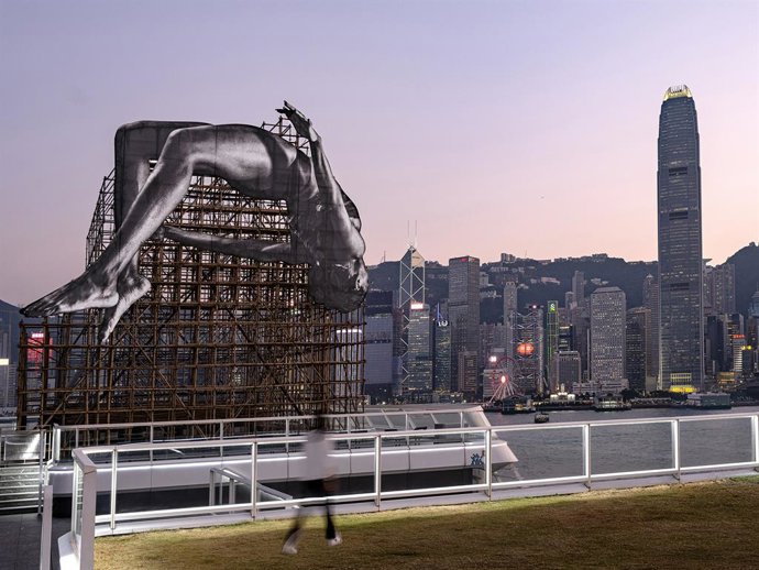 GIANTS: Rising Up Public Art Installation At Harbour City Shopping Mall Depicts A Gigantic High Jumper Floating In Mid-Air Adjacent To Hong KongS Iconic Victoria Harbour