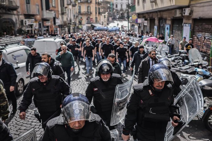 15 March 2023, Italy, Naples: Italian police escorted Eintracht Frankfurt fans through the city centre ahead of the UEFA Champions League round of 16 second-leg soccer match between SSC Napoli and Eintracht Frankfurt at Diego Armando Maradona Stadium. P
