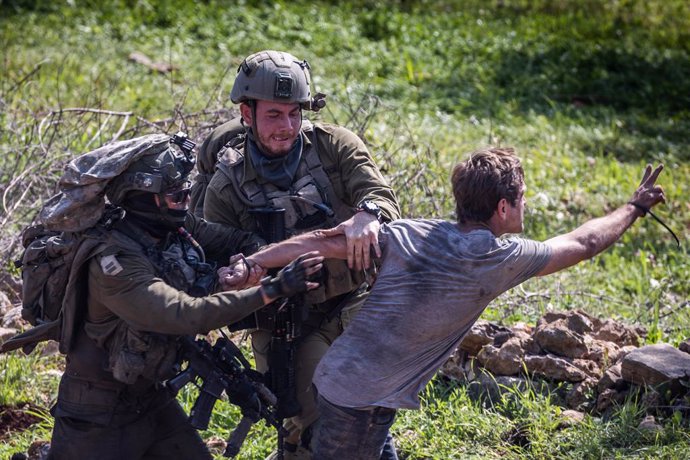 03 March 2023, Palestinian Territories, Huwara: Members of the Israeli security forces arrest a demonstrator during a march organised by activists from Israel and Palestine on their way to Huwara to show solidarity following the settler rampage there ea