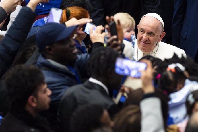 March 18, 2023, VATICAN CITY, ITALY: Pope Francis during an audience with a refugee families through the humanitarian corridors in the Paul VI Hall, Vatican City, 18 March 2023. ANSA/ANGELO CARCONI,Image: 763619124, License: Rights-managed, Restrictions