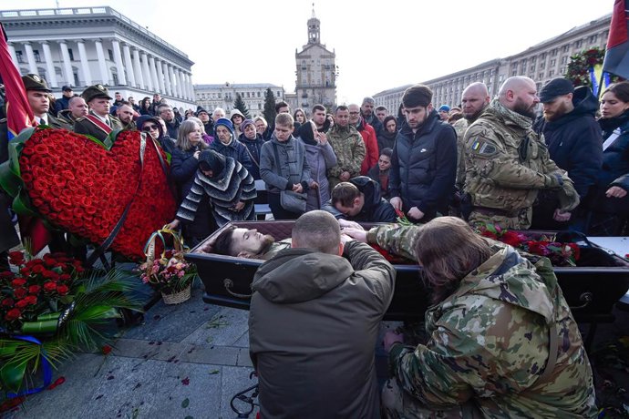 March 10, 2023, Kyiv, Ukraine: (EDITOR'S NOTE: Image depicts death).People pay their respect around the coffin with the body of the Ukrainian soldier Dmytro Kotsiubailo known as ''Da Vinci'' during the funeral ceremony on Independence Square in the cent