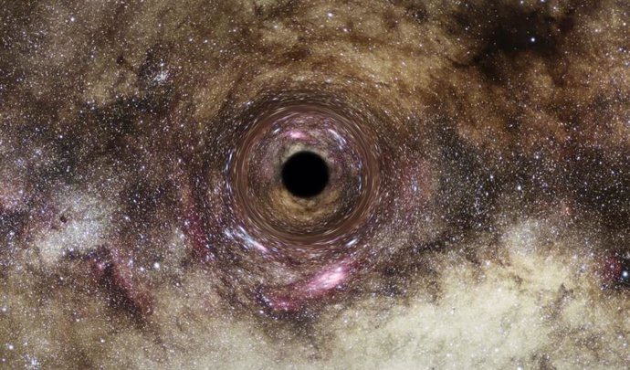 La impresión de un artista de un agujero negro, donde el intenso campo gravitatorio del agujero negro distorsiona el espacio que lo rodea.