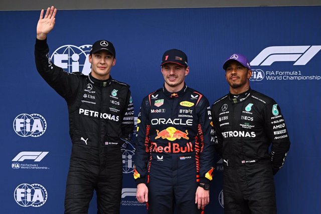 (L-R) George Russell of Mercedes, Max Verstappen of Red Bull Racing and Lewis Hamilton of Mercedes celebrate after Qualifying for the Formula 1 Australian Grand Prix at the Albert Park Circuit in Melbourne, Saturday, April 1, 2023. (AAP Image/Joel Carrett