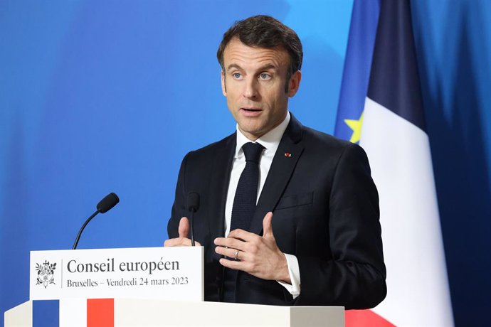 HANDOUT - 24 March 2023, Belgium, Brussels: France's President Emmanuel Macron speaks during a press conference at an EU summit in Brussels. European leaders met on Friday for the second day of a two-day EU summit focused on the bloc's economy after fin