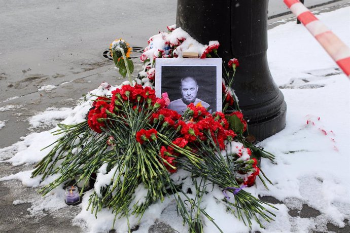 April 3, 2023, Saint-Petersburg, Russia: A portrait of Russian military blogger Vladlen Tatarsky, whose real name is Maxim Fomin, who was killed in the April 2 bomb blast in a cafe, is seen among flowers at a makeshift memorial by the explosion site in 