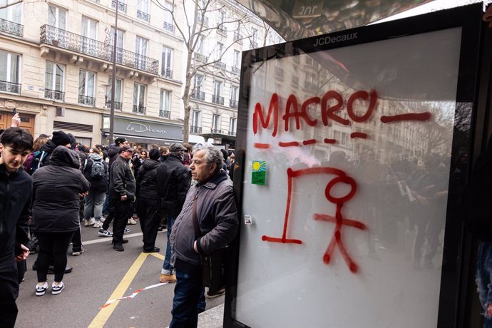 March 28, 2023, Paris, France: The hangman game with the word Macron seen at a bus stop during the rally against pension reform. The tenth anti-pension reform rally took thousands to the streets of Paris, in another day marked by violent clashes between
