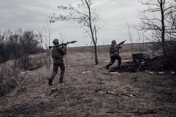 March 11, 2023, Donbass, Ukraine: Two Ukrainian soldiers go to the front to shoot at Russian positions.
