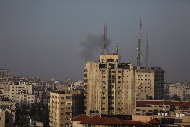 05 April 2023, Palestinian Territories, Gaza: Smoke billows over buildings in Gaza City as Israel launches air strikes on the Palestinian Strip. Several rockets were fired from the northern Gaza Strip towards the Israelis After clashes were announced at A
