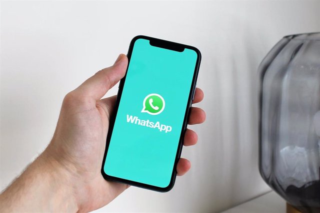 A mobile with the WhatsApp icon