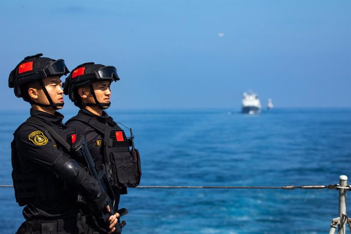 QINGDAO, March 31, 2023  -- Soldiers of the 42nd fleet of the Chinese People's Liberation Army Navy stand guard during sailing, on Feb. 8, 2023. A Chinese naval fleet returned to east China's port city of Qingdao in Shandong Province on Thursday after c