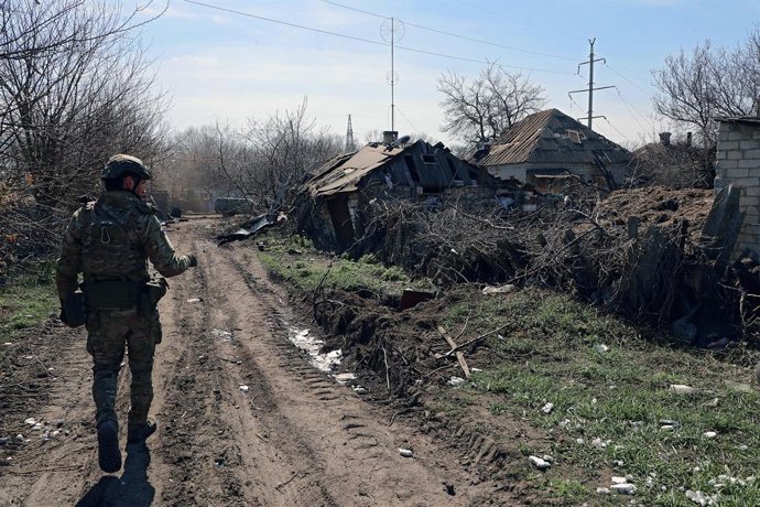 April 10, 2023, Chasiv Yar, Donetsk Region, Ukraine: A serviceman walks along a street, Chasiv Yar, Donetsk Region, eastern Ukraine.