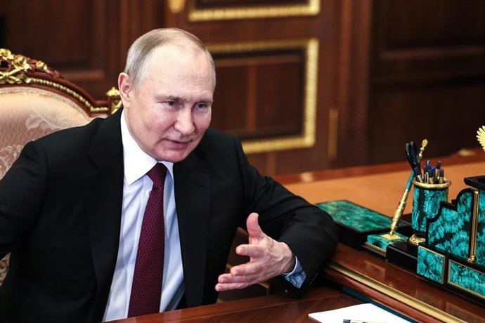 HANDOUT - 12 April 2023, Russia, Moscow: Russian President Vladimir Putin speaks with Director General of Roscosmos Yury Borisov (not pictured). Putin has described a planned Russian space station as a necessary step toward realizing ambitions for a nat