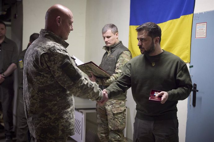 March 23, 2023, Kharkiv, Kharkiv Oblast, Ukraine: Ukrainian President Volodymyr Zelenskyy, right, awards medals to soldiers during a visit to the Kherson region, March 23, 2023 in Posad-Pokrovske, Kherson Oblast, Ukraine.