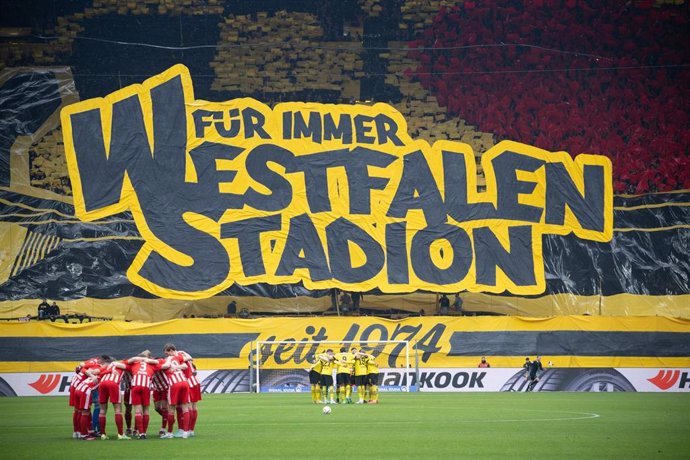 "Forever Westfalen Stadion" is written on a huge tarpaulin on the spectator stand ahead of the German Bundesliga soccer match between Borussia Dortmund and 1. FC Union Berlin at Signal Iduna Park. Photo: Bernd Thissen/dpa