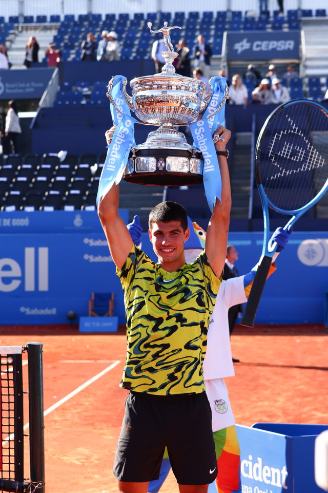 Carlos Alcaraz of Spain poses for photo with the champion trophy after winning against Stefanos Tsitsipas of Greece during the Final match of the Barcelona Open Banc Sabadell 2023