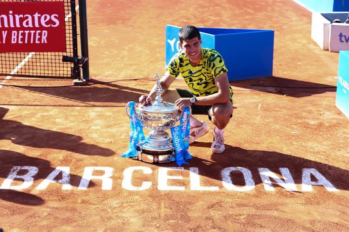 Carlos Alcaraz of Spain poses for photo with the champion trophy after winning against Stefanos Tsitsipas of Greece during the Final match of the Barcelona Open Banc Sabadell 2023