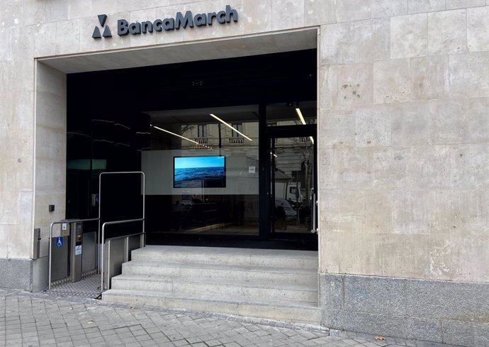 Archivo - Puerta principal de un local de Banca March en Madrid (España), a 13 de febrero de 2020.