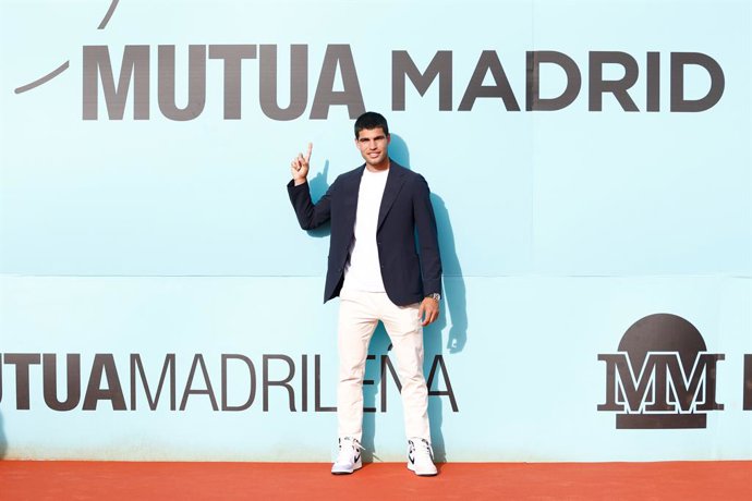 Carlos Alcaraz poses for photo during the presentation of the tennis tournament, Mutua Madrid Open, celebrates at Plaza de Colon on March 24, 2023 in Madrid, Spain.