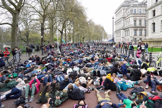 23 April 2023, United Kingdom, London: Extinction Rebellion demonstrators perform a die-in on day two of the the four-days environmental action "The Big One". Photo: Stefan Rousseau/PA Wire/dpa