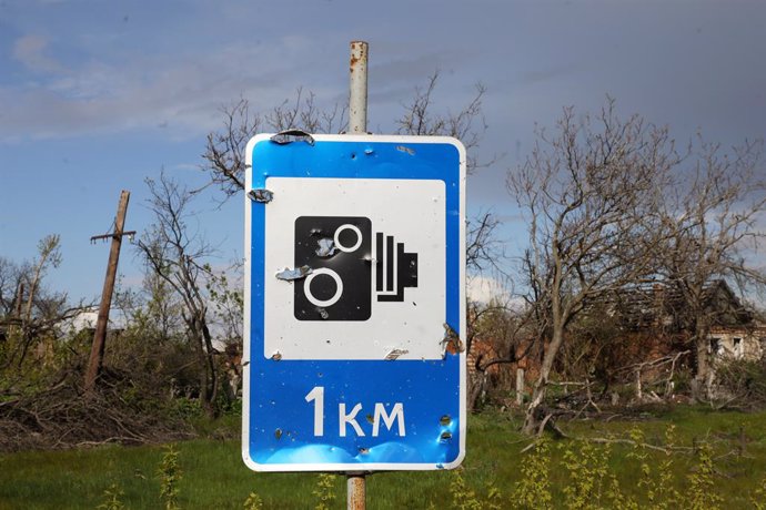 April 23, 2023, Dolyna, Donetsk Region, Ukraine: Shrapnel holes from the shelling of Russian troops dot a road sign in Dolyna, Donetsk Region, eastern Ukraine.