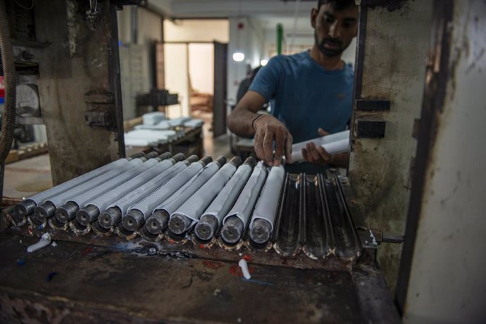 April 8, 2023, Meerut, Uttar Pradesh, India: A worker makes rubber bat grip at the Stanford cricket equipment factory, Mawana Road. Meerut is one of the prominent Centre in the country for the manufacture of sports goods.