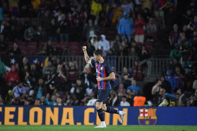 Robert Lewandowski celebrates after scoring his side's third goal of the game during the Spanish Primera Division soccer match between FC Barcelona and Real Betis at Spotify Camp Nou stadium
