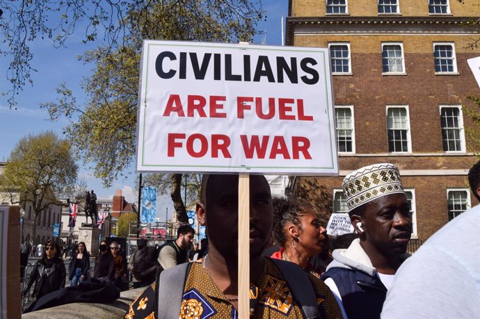 April 29, 2023, London, United Kingdom: A protester holds an anti-war placard during the demonstration. Protesters gathered in Whitehall calling for an end to the war in Sudan.
