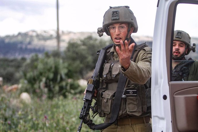 April 11, 2023, Nablus, West bank, Palestine: An Israeli soldier gestures with his hand during a military operation, after the Israeli army forces killed Palestinian gunmen, near Elon Moreh, east of Nablus, in the West Bank.