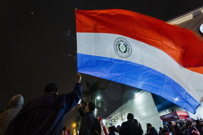 May 2, 2023, Asuncion, Paraguay: A demonstrator waves a Paraguayan national flag during a demostration against the alleged electoral fraud in the recent general elections held on April 30, in the vicinity of the Superior Court of Electoral Justice (TSJE