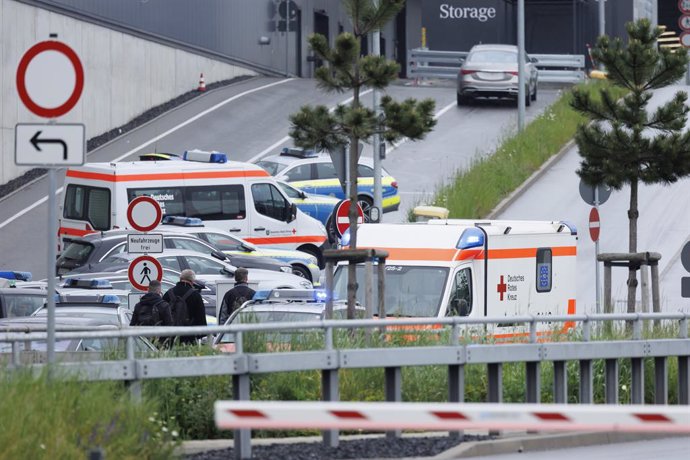 11 May 2023, Baden-Wuerttemberg, Sindelfingen: Police cars and ambulances are parked at a Mercedes-Benz plant. One person was killed, and at least one person was seriously injured after shots were fired at the site of a Mercedes-Benz plant in south-west
