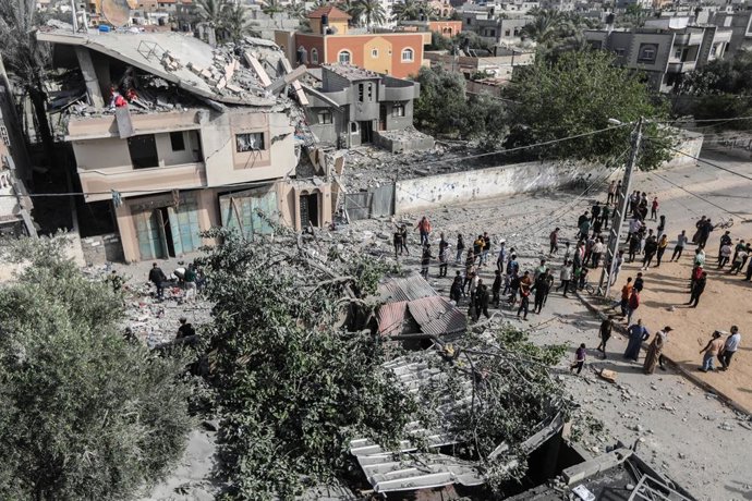 May 12, 2023, Gaza, Palestine: Palestinians inspect the damage of a house hit by the Israeli airstrikes in Khan Yunis, in the southern Gaza Strip.