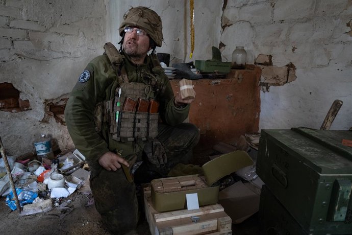 April 24, 2023, Ukraine: A Ukrainian soldier is seen holding a packet of bullets near Soledar. The eastern Ukrainian town in Donetsk region has been sieged by Russian armed force in January. The siege has provided advantage on the encirclement of nearby