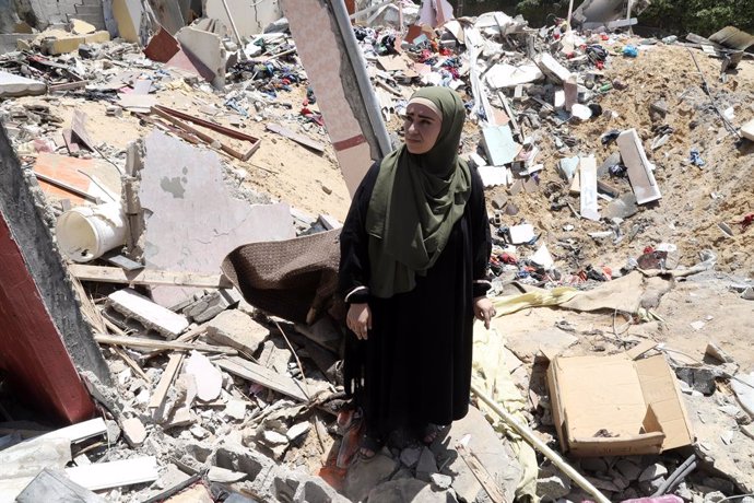 May 14, 2023, Nuseirat, Gaza Strip, Palestinian Territory: Palestinians inspect the rubble of a house after it was hit by an Israeli air strike in the Nuseirat refugee camp in the central Gaza Strip on May 14, 2023. An Egypt-brokered ceasefire went into