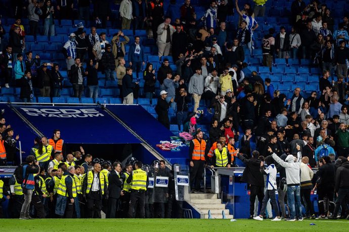 Espanyol fans invade the field and are evicted by the Mossos de Esquadra during the spanish league, La Liga Santander, football match played between RCD Espanyol and FC Barcelona  at RCD Stadium on May 14, 2023, in Barcelona, Spain.