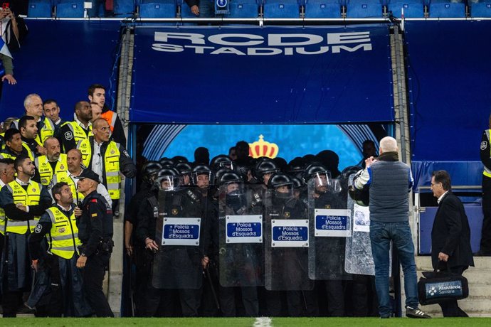 Espanyol fans invade the field and are evicted by the Mossos de Esquadra during the spanish league, La Liga Santander, football match played between RCD Espanyol and FC Barcelona  at RCD Stadium on May 14, 2023, in Barcelona, Spain.
